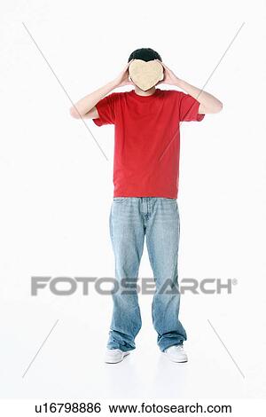 a boy with a heart covering his face View Large Photo Image Stock Photograph - a boy with a heart covering his face. Fotosearch