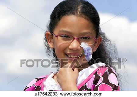 a girl holding a flower View Large Photo Image Stock Image - a girl holding a flower. Fotosearch