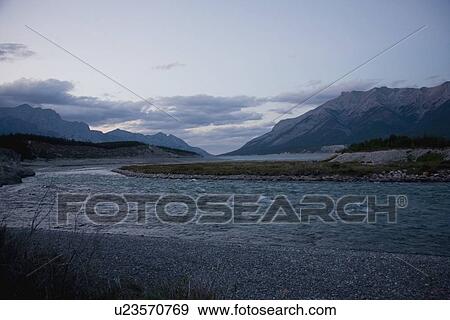 Stock Photo - a river running through the mountains. Fotosearch
