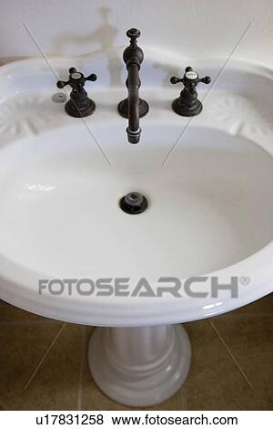 a white bathroom pedestal sink View Large Photo Image Stock Photo - a white bathroom pedestal sink. Fotosearch