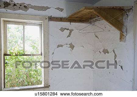 a wooden corner shelf and window along a wall with peeling paint View Large Photo Image Picture - a wooden corner shelf and window along a wall with peeling paint. Fotosearch
