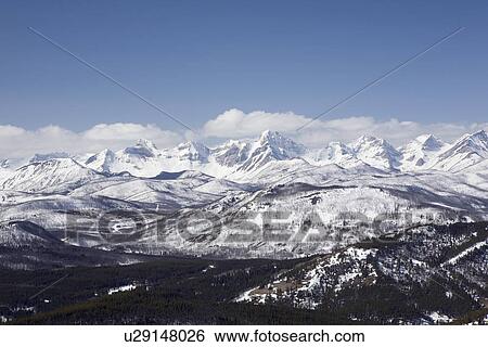Stock Photograph - alberta, canada; view of the front range mountains and foothills from carbondale hill. Fotosearch