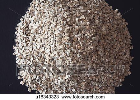 Stock Image - pile of rye flakes. Fotosearch
