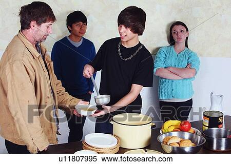 teenagers serving a meal to a man View Large Photo Image Stock Photography - teenagers serving a meal to a man. Fotosearch