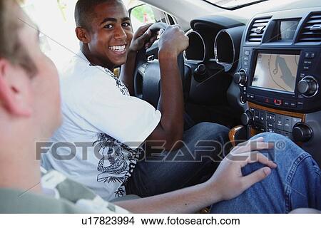 two boys in the front seat of a car View Large Photo Image Picture - two boys in the front seat of a car. Fotosearch