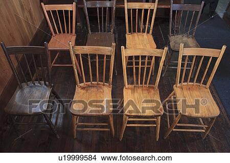 Picture - wooden chairs set up in rows. Fotosearch