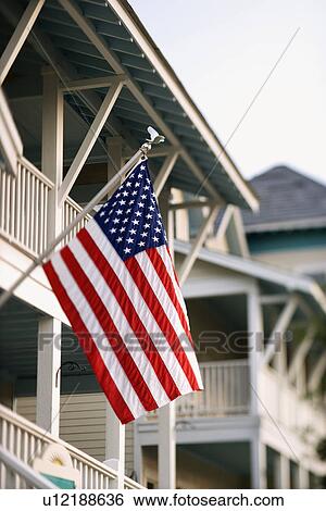 Stock Photograph - American Flag on Home. Fotosearch