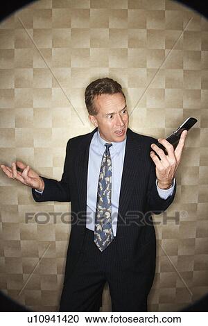 Angry Businessman on Cell Phone View Large Photo Image Stock Image - Angry Businessman on Cell Phone. Fotosearch