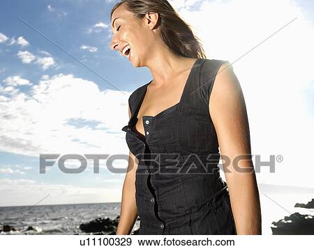 Stock Photo - Attractive Young Woman Laughing. Fotosearch