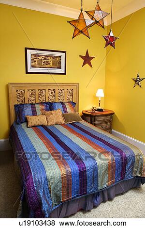Bedroom Interior With Striped Bedspread and Decorative Stars View Large Photo Image Stock Photo - Bedroom Interior With Striped Bedspread and Decorative Stars. Fotosearch