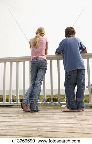 Stock Image - Boy and Girl at the Beach. Fotosearch