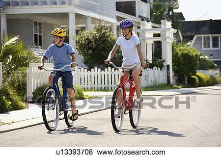 Boy and Girl Riding Bikes View Large Photo Image Stock Photo - Boy and Girl Riding Bikes. Fotosearch