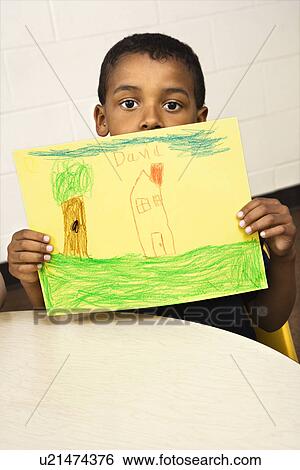 Boy Holding Drawing View Large Photo Image Stock Photograph - Boy Holding Drawing. Fotosearch