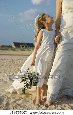 Bride and Flower Girl on Beach View Large Photo Image Stock Image - Bride and Flower Girl on Beach. Fotosearch