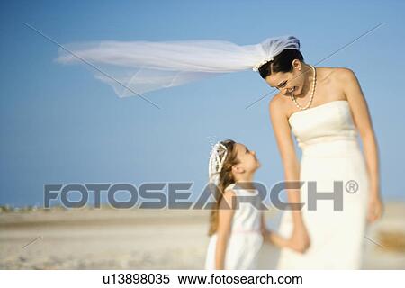 Bride and Flower Girl on Beach View Large Photo Image Stock Photography - Bride and Flower Girl on Beach. Fotosearch
