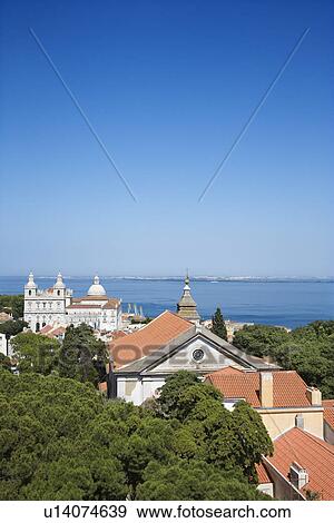 Buildings and Ocean in Lisbon View Large Photo Image Stock Photo - Buildings and Ocean in Lisbon. Fotosearch