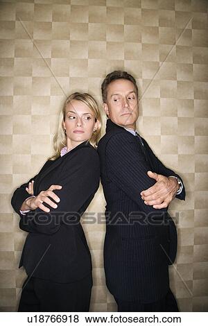 Stock Photo - Business Man and Woman Back to Back. Fotosearch