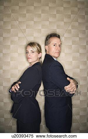 Stock Photography - Business Man and Woman Back to Back. Fotosearch