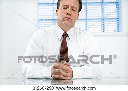 Businessman at desk View Large Photo Image Stock Image - Businessman at desk. Fotosearch