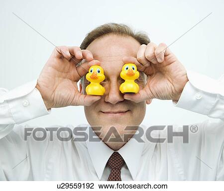 Stock Image - Businessman goofing off. Fotosearch