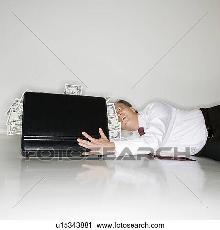 Businessman grabbing money View Large Photo Image Stock Image - Businessman grabbing money. Fotosearch