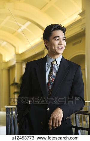 Stock Image - Businessman in Hotel. Fotosearch