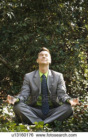Businessman in Meditation Outside View Large Photo Image Stock Photograph - Businessman in Meditation Outside. Fotosearch