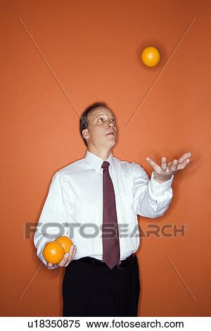 Businessman juggling View Large Photo Image Stock Photography - Businessman juggling. Fotosearch