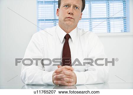 Stock Photo - Businessman looking serious. Fotosearch