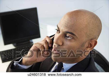 Stock Photo - Businessman on phone.. Fotosearch