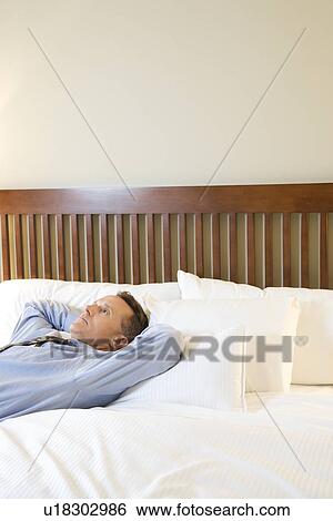 Businessman Relaxing on Bed View Large Photo Image Stock Photograph - Businessman Relaxing on Bed. Fotosearch