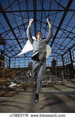Businessman Wearing Angel Wings View Large Photo Image Stock Photograph - Businessman Wearing Angel Wings. Fotosearch
