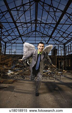 Businessman Wearing Angel Wings View Large Photo Image Stock Photography - Businessman Wearing Angel Wings. Fotosearch