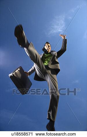 Stock Image - Businessman With Briefcase Jumping. Fotosearch