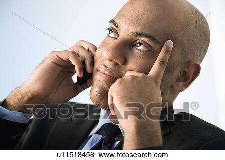 Stock Photo - Businessman with cellphone. Fotosearch