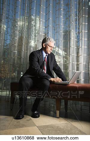 Stock Photo - Businessman with Laptop Computer.. Fotosearch
