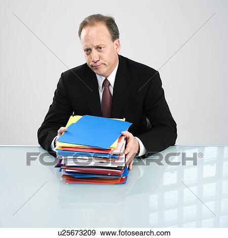 Businessman with workload View Large Photo Image Stock Photo - Businessman with workload. Fotosearch