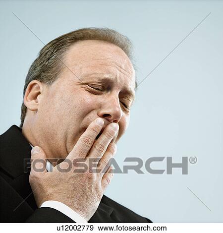 Businessman yawning View Large Photo Image Stock Photo - Businessman yawning. Fotosearch