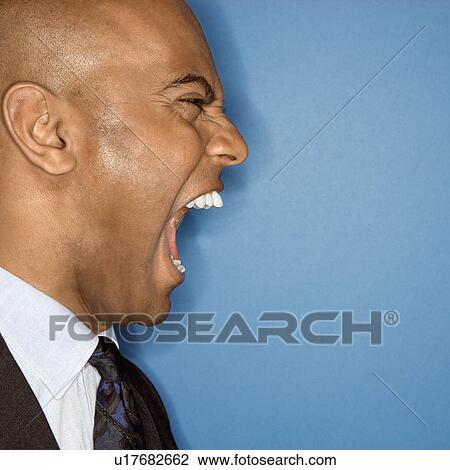 Stock Image - Businessman yelling. Fotosearch