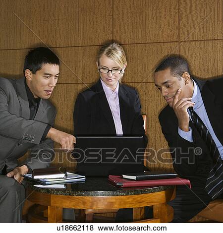 Businesspeople Looking at Laptop View Large Photo Image Stock Photo - Businesspeople Looking at Laptop. Fotosearch