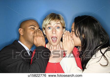 Stock Photograph - Businesspeople telling secrets. Fotosearch