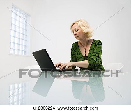 Businesswoman in office View Large Photo Image Picture - Businesswoman in office. Fotosearch