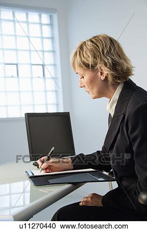 Businesswoman in office. View Large Photo Image Stock Image - Businesswoman in office.. Fotosearch