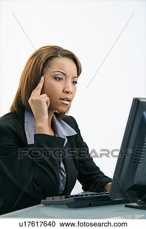 Businesswoman on computer View Large Photo Image Stock Image - Businesswoman on computer. Fotosearch