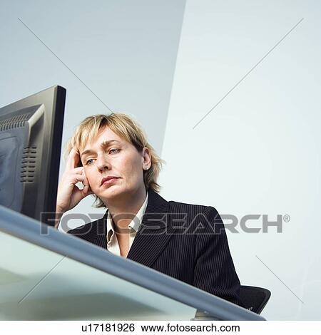 Businesswoman on computer View Large Photo Image Stock Photograph - Businesswoman on computer. Fotosearch