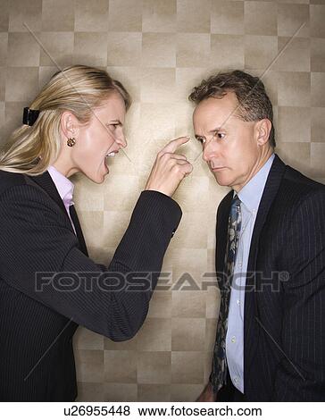 Stock Photo - Businesswoman Reprimanding Businessman. Fotosearch