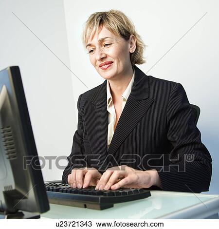Businesswoman typing. View Large Photo Image Stock Image - Businesswoman typing.. Fotosearch