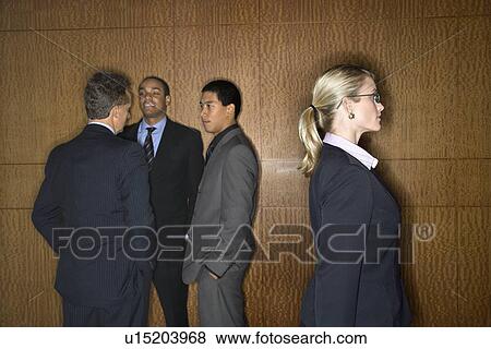 Businesswoman Walking by Businessmen View Large Photo Image Stock Photo - Businesswoman Walking by Businessmen. Fotosearch