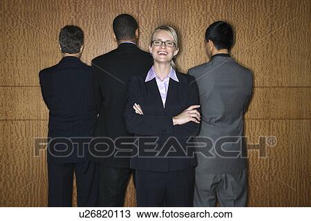 Stock Image - Businesswoman with Businessmen. Fotosearch