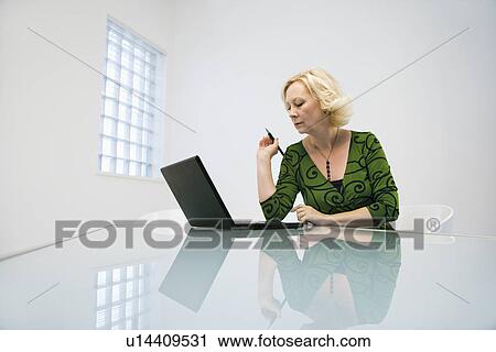 Businesswoman with laptop View Large Photo Image Stock Image - Businesswoman with laptop. Fotosearch